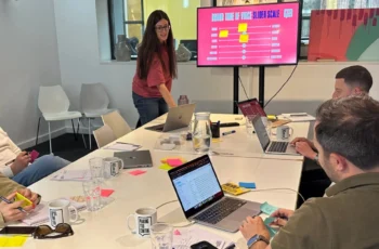 A team of marketers around a table during a content marketing strategy exercise